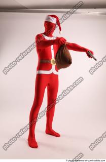 JOEL_ADAMSON CHRISTMAS VALLAIN WITH GUN AND BAG